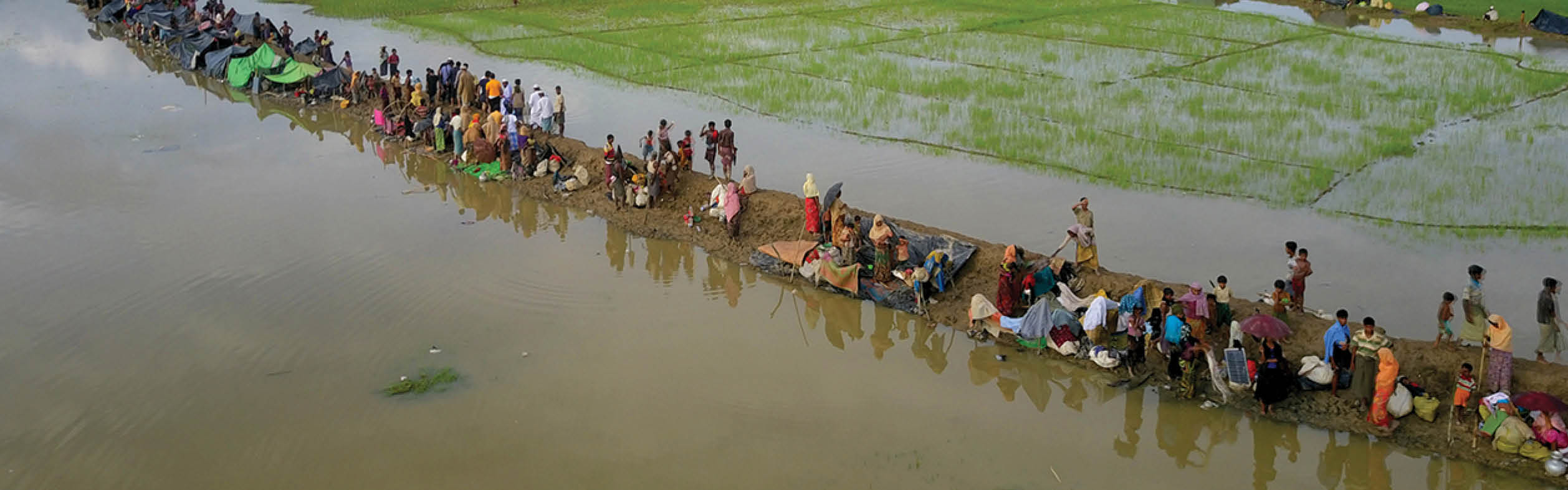 PALONGKHALI, UKHYA, COX S BAZAR, BANGLADESH- SEPTEMBER 08, 2017: Aerial view of Rohingya refujees are waiting to go camap  at Palongkhali, Cox s bazar Thousands of Rohingyas still crossing the border between Myanmar and Bangladesh after the Burmese army started an operation against the Rohingyas, by burning and destroying their home in the Rakhine state of Myanmar, as now more than 410,000 Rohingyas crossed the border and the United Nations expect the number rises to 1 million by the end of the year 